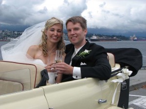 Bride and Groom in convertible Vancouver wedding car in Stanley Park